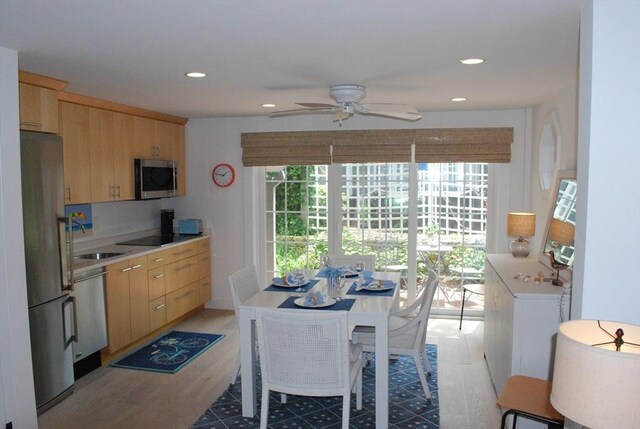 5 Hydrangea Ln Unit 5, Mashpee, MA 02649 - kitchen featuring appliances with stainless steel finishes, light brown cabinetry, light wood finished floors, ceiling fan, and light countertops