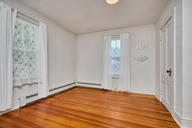 154 N Maple St, Northampton, MA 01062 - unfurnished room with wood finished floors, healthy amount of natural light, and baseboard heating