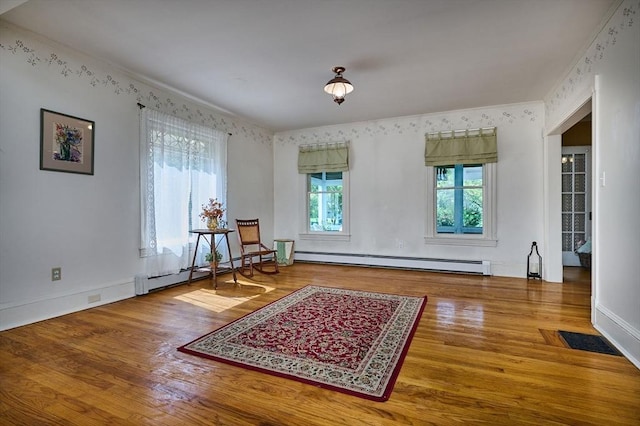 154 N Maple St, Northampton, MA 01062 - sitting room with baseboard heating and wood finished floors