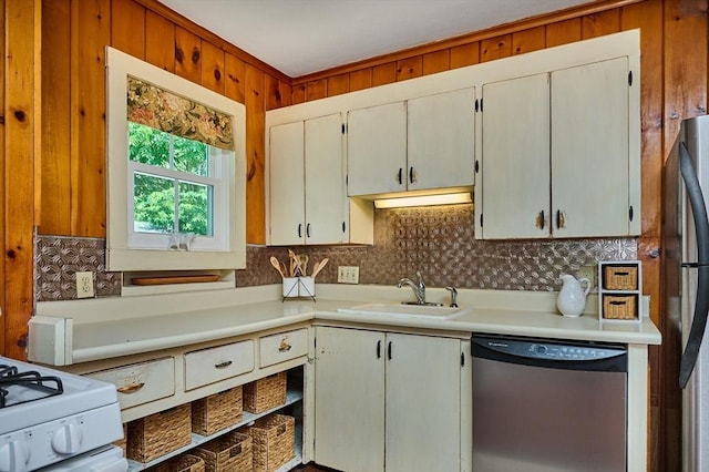154 N Maple St, Northampton, MA 01062 - kitchen with appliances with stainless steel finishes, light countertops, decorative backsplash, and wood walls