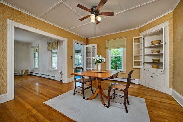 154 N Maple St, Northampton, MA 01062 - dining space with a baseboard radiator, plenty of natural light, wood finished floors, a ceiling fan, and wallpapered walls