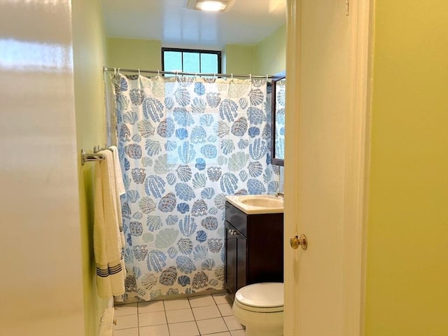 full bathroom featuring tile patterned flooring, toilet, vanity, and curtained shower