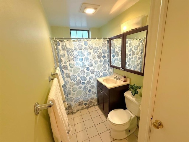 bathroom featuring toilet, tile patterned floors, vanity, and a shower with curtain