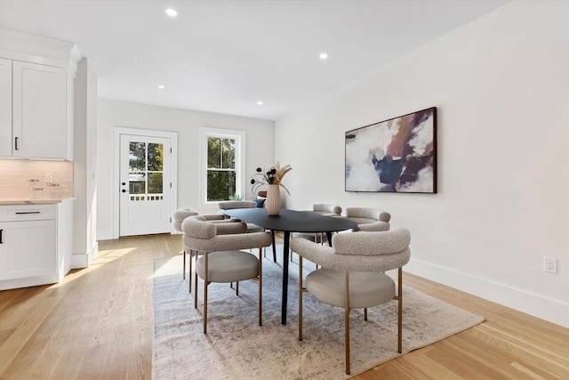 dining space with light wood-type flooring