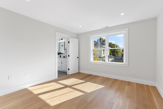 unfurnished room featuring light hardwood / wood-style floors