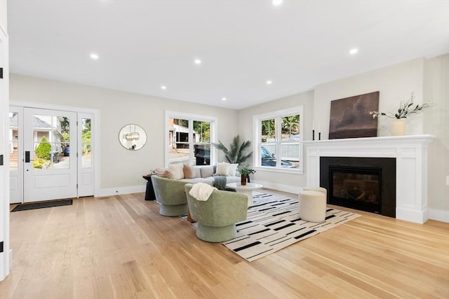 living room with a healthy amount of sunlight and light wood-type flooring