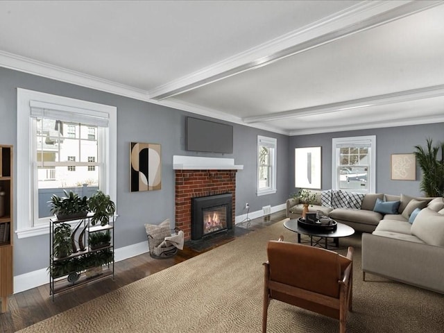 living area featuring ornamental molding, a brick fireplace, baseboards, and wood finished floors