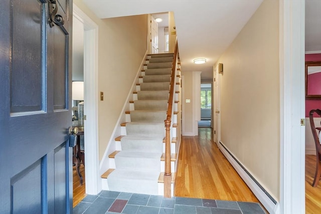 15 Thoreau Rd, Acton, MA 01720 - foyer entrance with baseboard heating, wood finished floors, and stairs