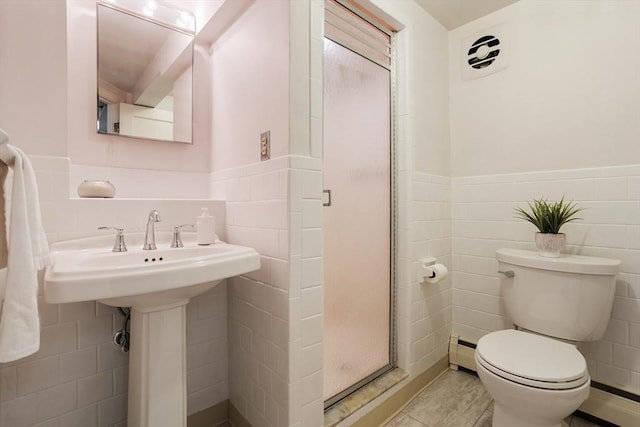 15 Thoreau Rd, Acton, MA 01720 - full bath featuring tile walls, a baseboard heating unit, a shower stall, and a wainscoted wall