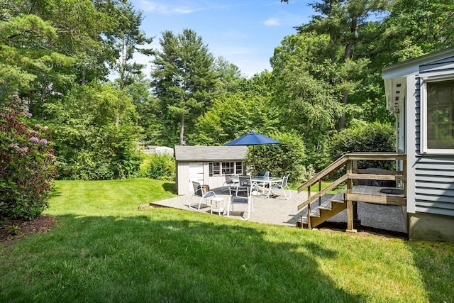 15 Thoreau Rd, Acton, MA 01720 - view of grassy yard featuring an outdoor structure, a patio area, and stairway