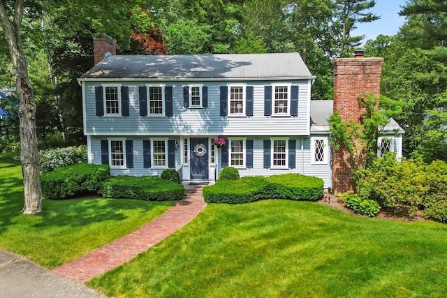 15 Thoreau Rd, Acton, MA 01720 - colonial house featuring a chimney and a front lawn