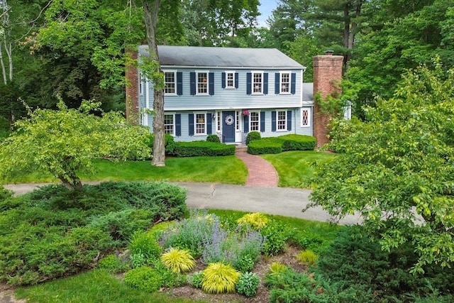 15 Thoreau Rd, Acton, MA 01720 - colonial home featuring a chimney and a front lawn