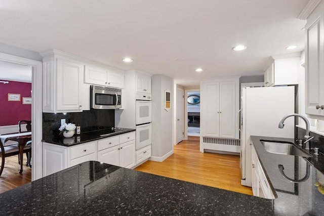 15 Thoreau Rd, Acton, MA 01720 - kitchen featuring white appliances, light wood-style flooring, white cabinets, and recessed lighting