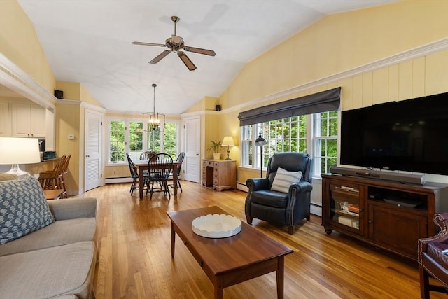 15 Thoreau Rd, Acton, MA 01720 - living room with vaulted ceiling, a chandelier, ceiling fan, light wood-style floors, and a baseboard radiator