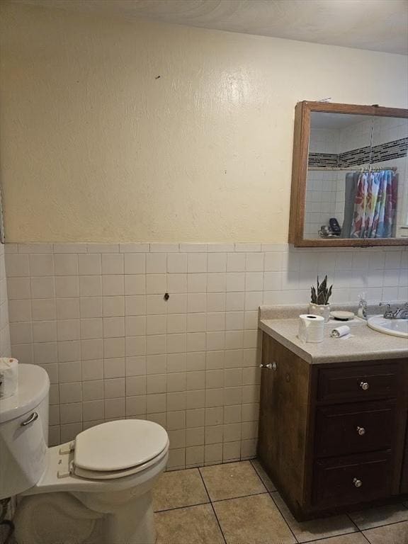 192 Chestnut St, Chelsea, MA 02150 - bathroom with toilet, tile walls, vanity, tile patterned flooring, and a textured wall