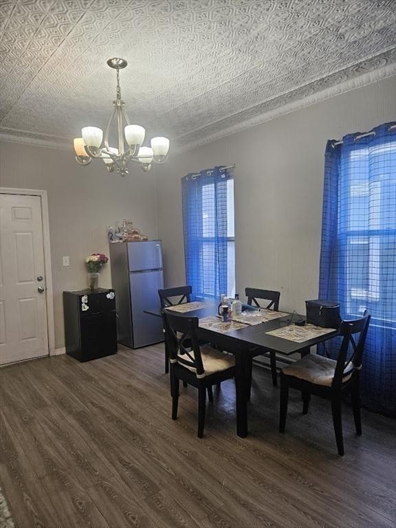 192 Chestnut St, Chelsea, MA 02150 - dining space featuring a chandelier and dark wood-type flooring