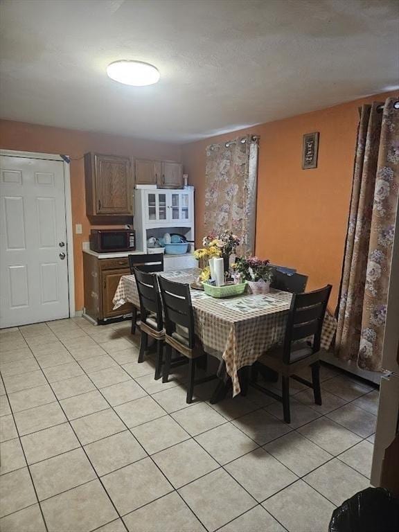 192 Chestnut St, Chelsea, MA 02150 - dining space with light tile patterned floors