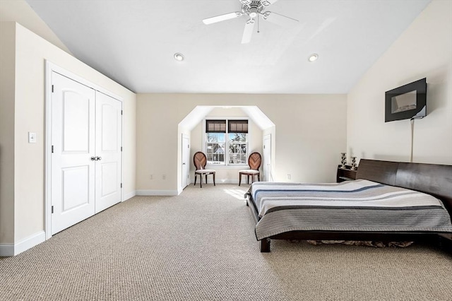 bedroom with carpet floors, a closet, ceiling fan, and vaulted ceiling