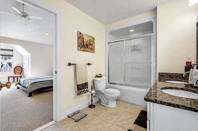 full bathroom with shower / bath combination with glass door, ceiling fan, vanity, tile patterned floors, and toilet