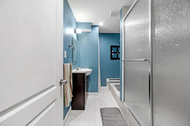 bathroom featuring an enclosed shower, vanity, and baseboard heating