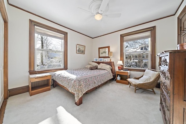 bedroom with ceiling fan and light colored carpet