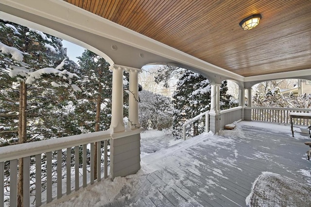 view of snow covered deck