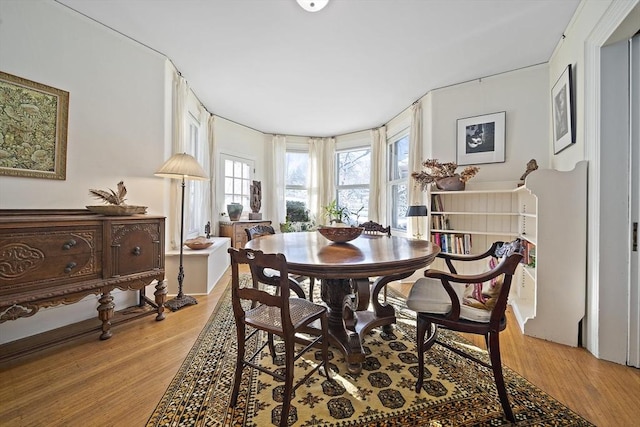 dining area with hardwood / wood-style flooring