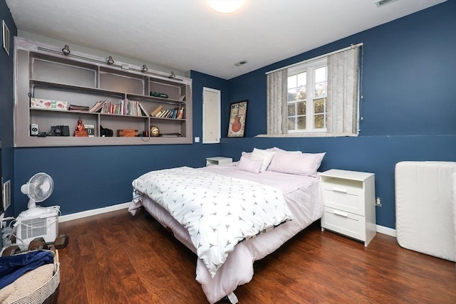 bedroom featuring dark hardwood / wood-style floors