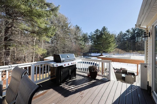 deck featuring a grill