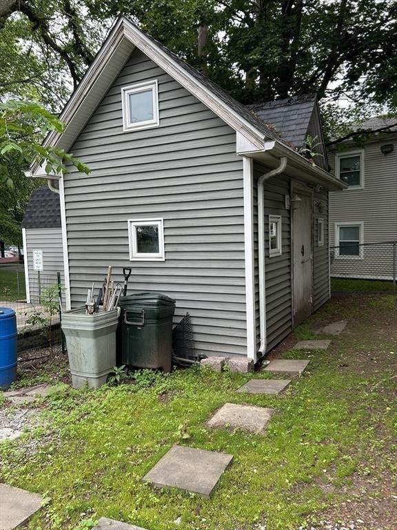 39R Spring St, Boston, MA 02132 - view of home's exterior with roof with shingles