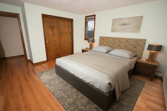 bedroom featuring a closet and hardwood / wood-style flooring