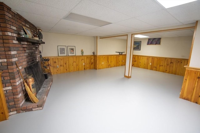 basement featuring a paneled ceiling