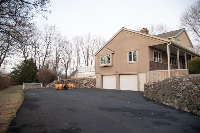 view of property exterior with a garage