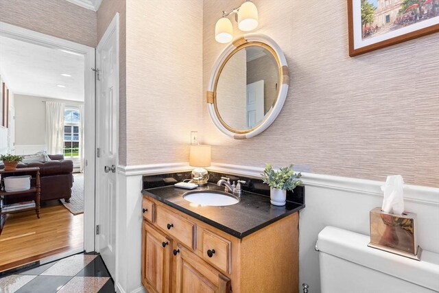38 Thoreau Cir, Beverly, MA 01915 - half bathroom featuring vanity, toilet, wainscoting, and wallpapered walls