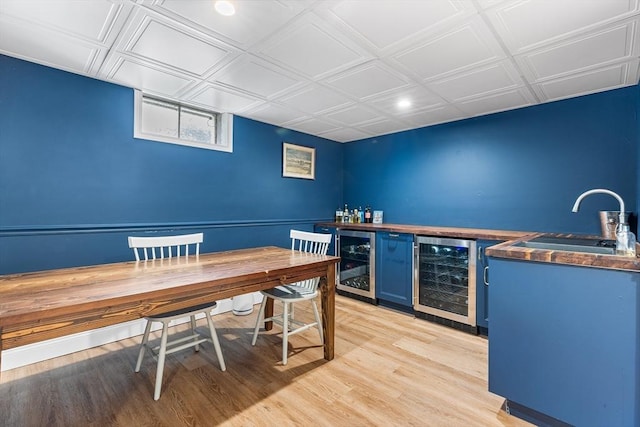 38 Thoreau Cir, Beverly, MA 01915 - home office with wine cooler, bar, light wood finished floors, an ornate ceiling, and recessed lighting