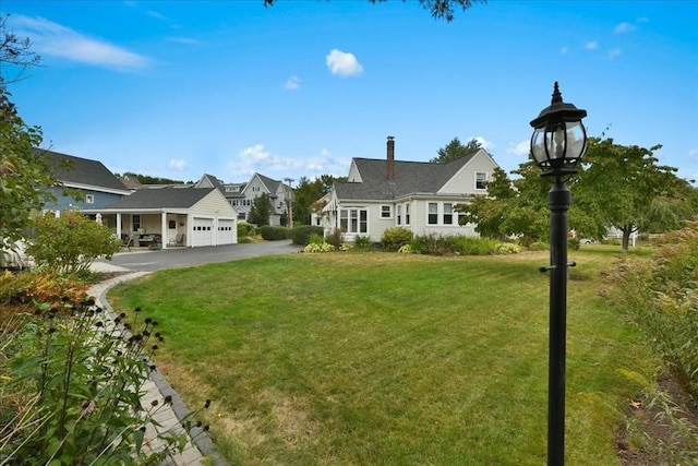 view of yard featuring a garage