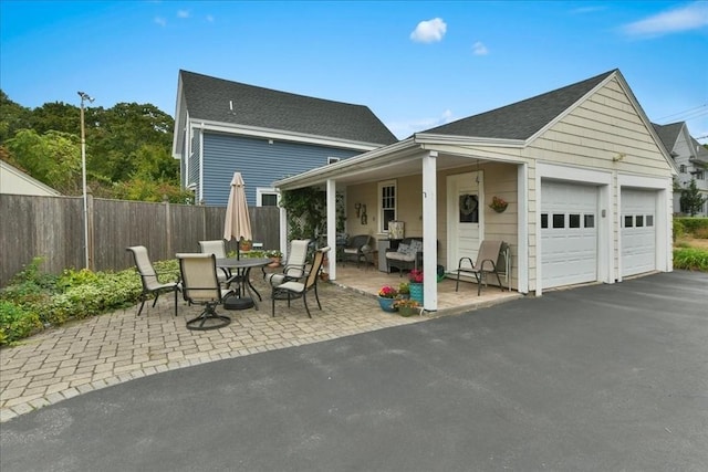 exterior space with a garage and a patio area