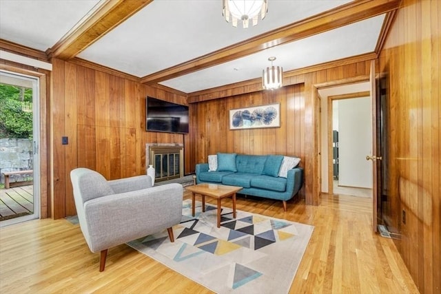 124 Mount Vernon Rd W, Weymouth, MA 02189 - living room with beam ceiling, light wood-type flooring, wooden walls, and a brick fireplace