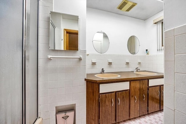 124 Mount Vernon Rd W, Weymouth, MA 02189 - bathroom featuring tile walls, a shower with shower door, and double vanity