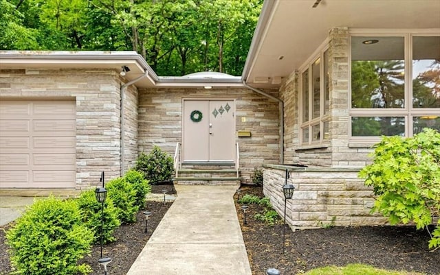 124 Mount Vernon Rd W, Weymouth, MA 02189 - entrance to property featuring stone siding and a garage
