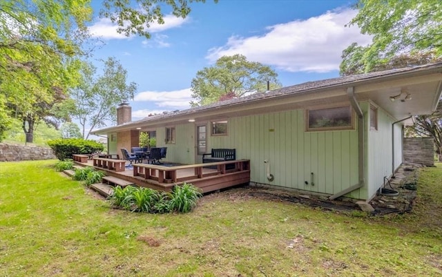 124 Mount Vernon Rd W, Weymouth, MA 02189 - rear view of house with a lawn, a chimney, and a wooden deck