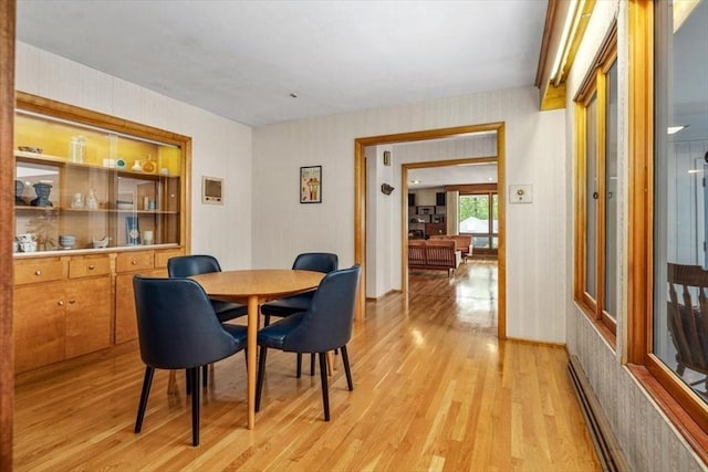 124 Mount Vernon Rd W, Weymouth, MA 02189 - dining room featuring light wood-type flooring, wallpapered walls, and a baseboard radiator
