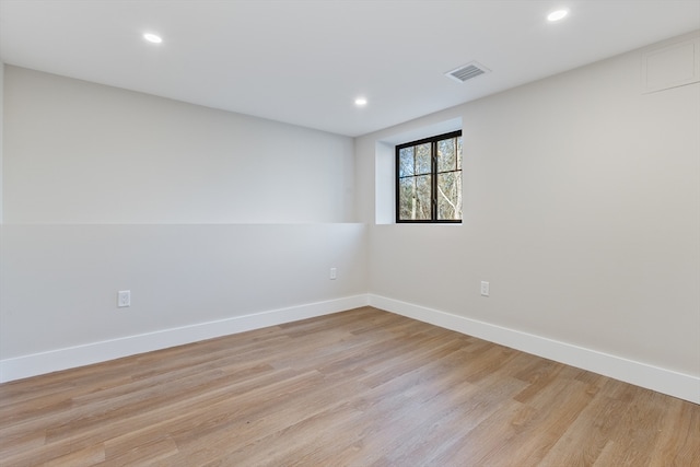 spare room with light hardwood / wood-style flooring