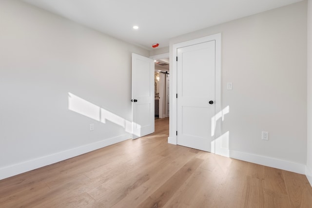 empty room with light hardwood / wood-style floors