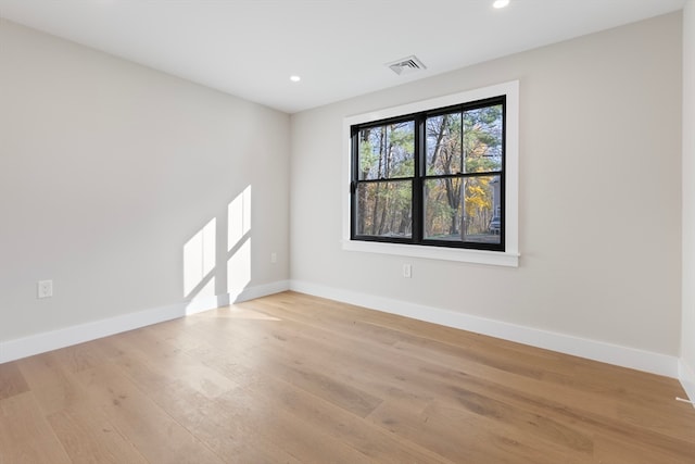 unfurnished room with light hardwood / wood-style flooring