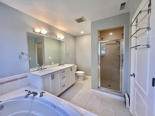 141 Pearl St Unit 141, Newton, MA 02458 - full bathroom with double vanity, a shower stall, a garden tub, and tile patterned flooring