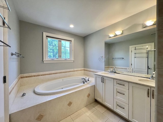 141 Pearl St Unit 141, Newton, MA 02458 - full bath with double vanity, a whirlpool tub, tile patterned flooring, and recessed lighting