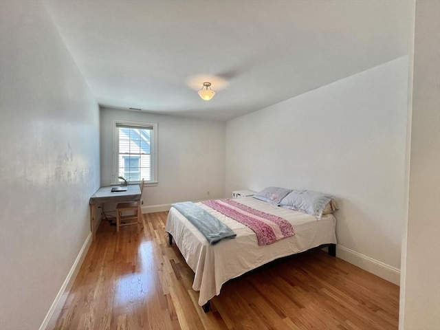 141 Pearl St Unit 141, Newton, MA 02458 - bedroom with light wood-style flooring and baseboards