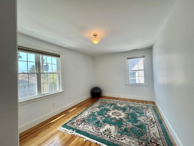 141 Pearl St Unit 141, Newton, MA 02458 - spare room with wood finished floors and baseboards