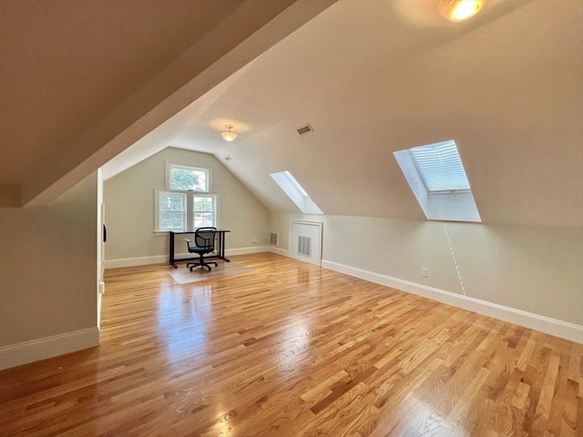 141 Pearl St Unit 141, Newton, MA 02458 - bonus room featuring a skylight, light wood-type flooring, and vaulted ceiling